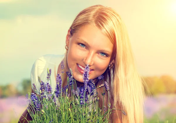 Girl with Flowers in Lavender Field