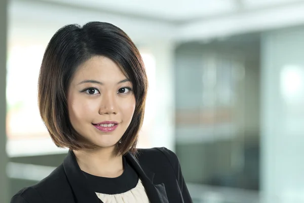 Close up of happy Chinese business woman.