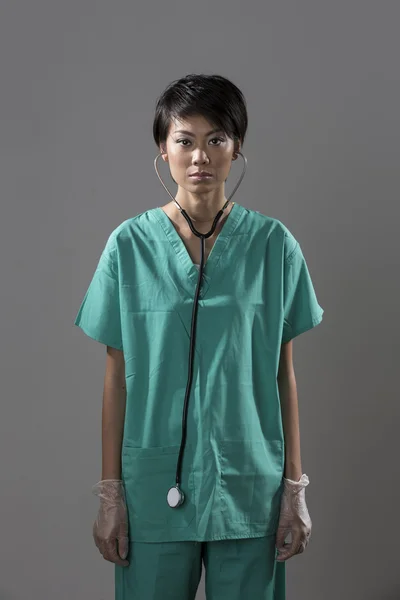 Chinese Doctor in surgical scrubs with stethoscope