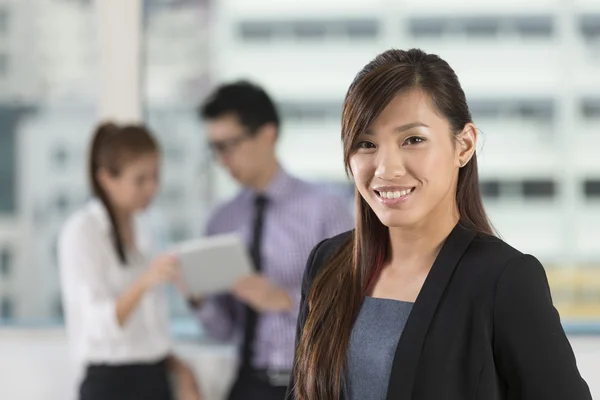 Asian business woman standing in office