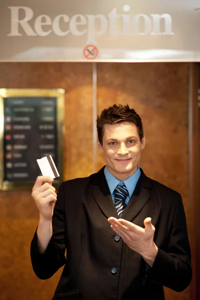 Snap shot of handsome guy holding cash card