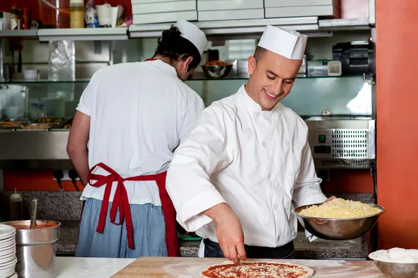 Expert chefs at work inside restaurant kitchen