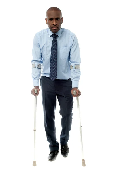 African businessman man with crutch