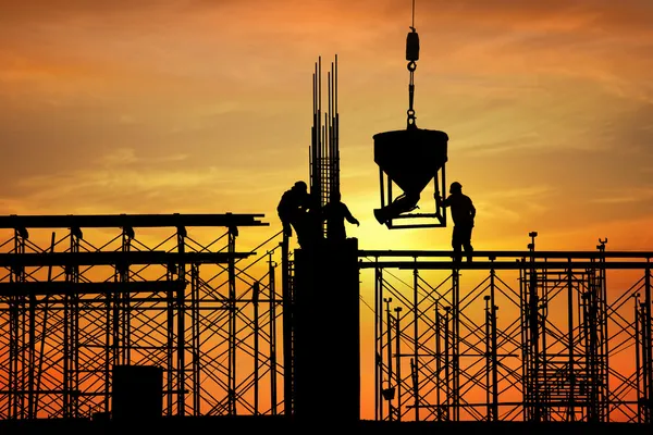 Silhouette of construction worker on construction site