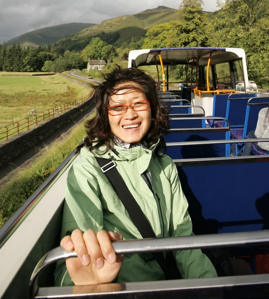 Woman on a tour bus, Lake District