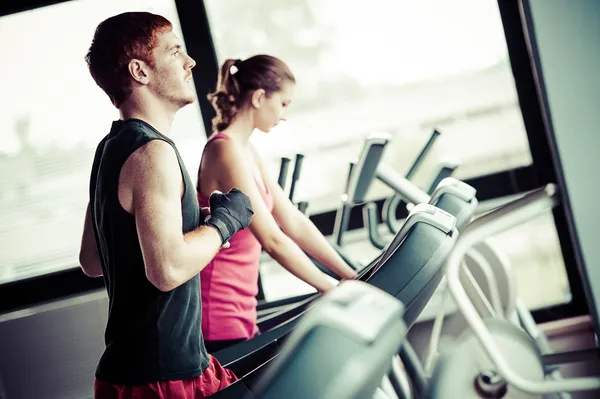 Running on treadmill in gym or fitness club