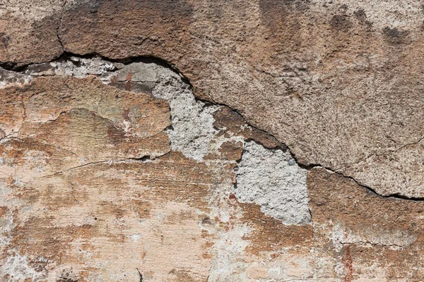 Badly damaged plaster concrete wall wallpaper