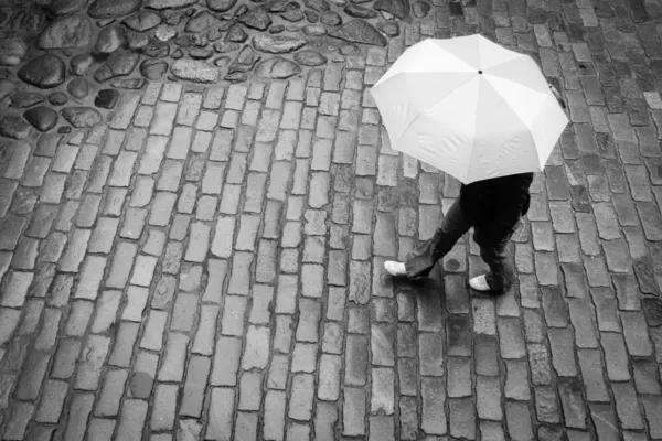 Woman with umbrella in rain