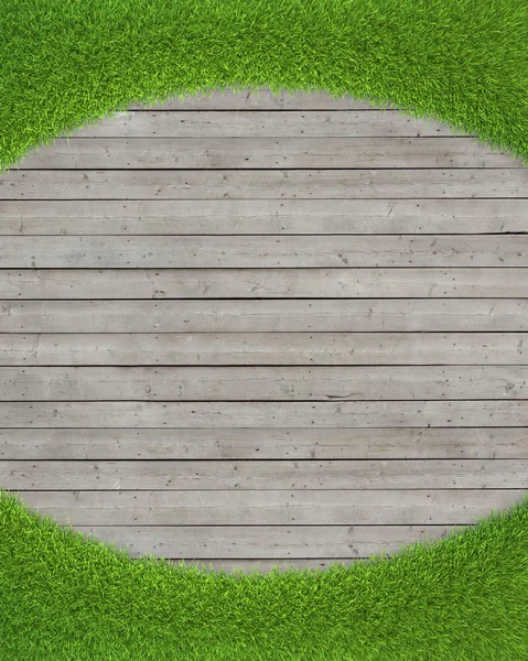 Green grass on wood floor background
