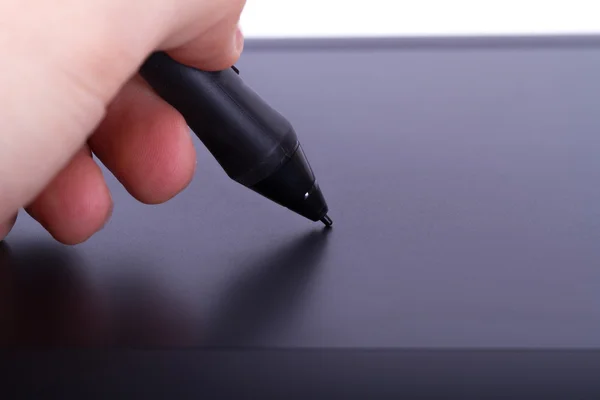 Artist Holding Digital Pen on Tablet