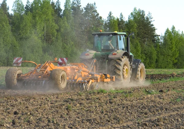 Arable land, sow seed on the tractor