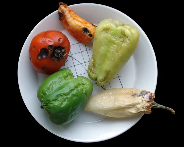 Rotten vegetables on the plate