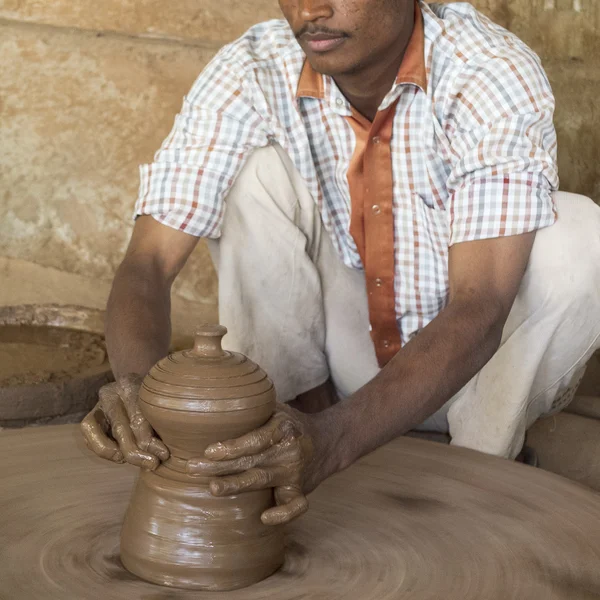 Indian potter working.