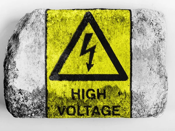 High voltage sign drawn at painted on brick