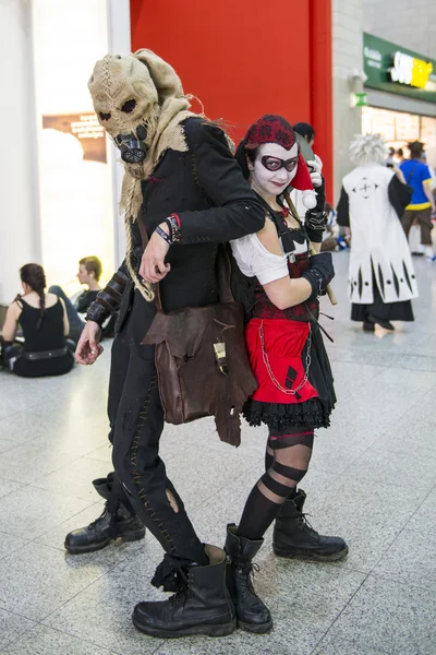 LONDON, UK - OCTOBER 26: Cosplayers dressed as a  Harley Quinn a