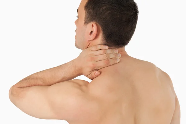 Young man experiencing neck pain