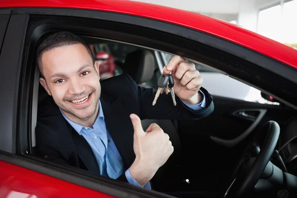 Happy man holding car keys