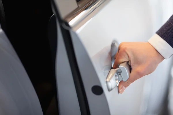 Man opening a car door