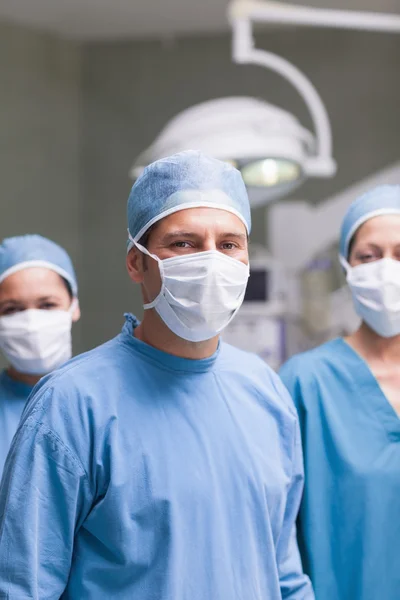 Medical team wearing mask and cap