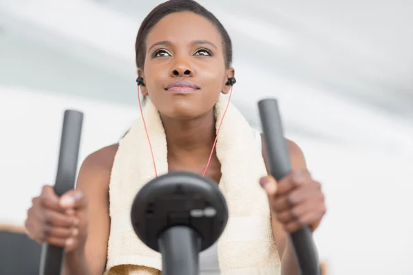 Low angle view of a black woman doing exercise bike