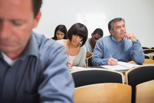 Adult class taking notes