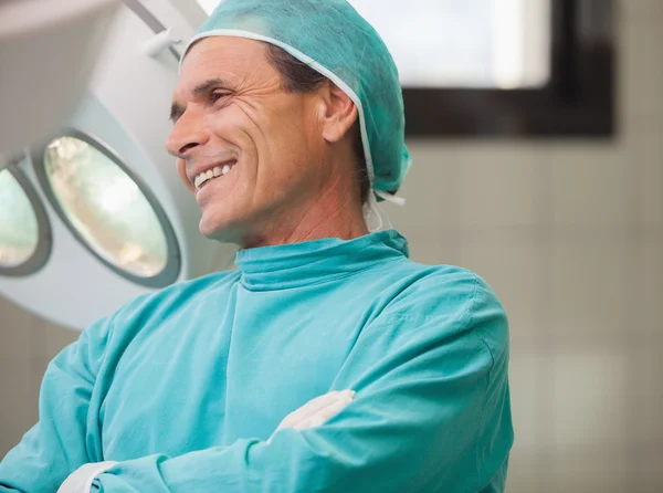 Surgeon smiling with arms crossed