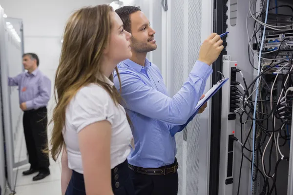 Technicians doing maintenance on servers