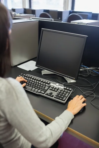 Woman working at a computer