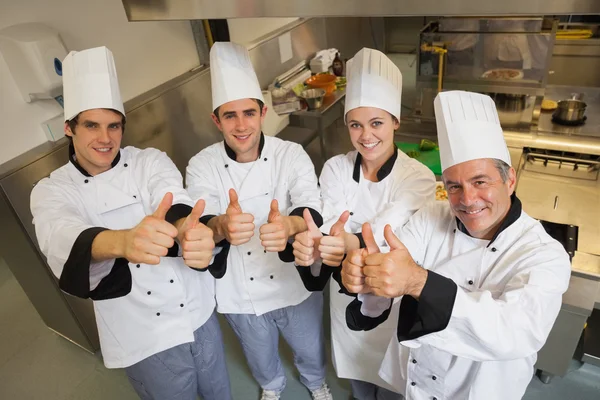 Team of Chef\'s giving thumbs up