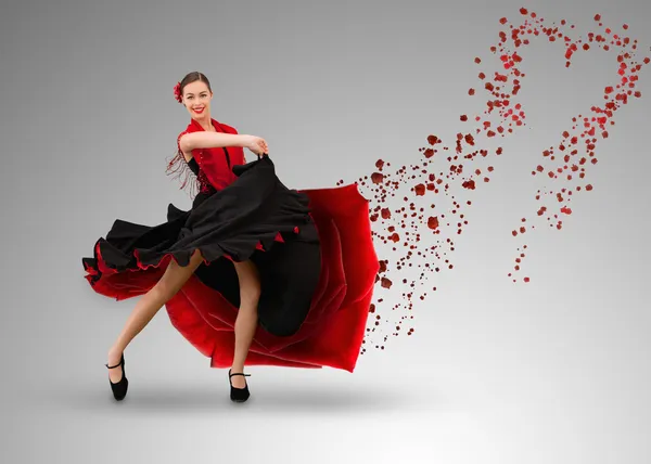 Smiling flamenco dancer with heart shaped paint splatter coming from dress