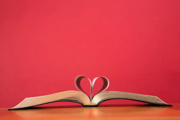 Book with pages folded to form heart
