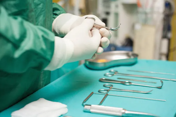 Surgeon choosing a surgical instrument