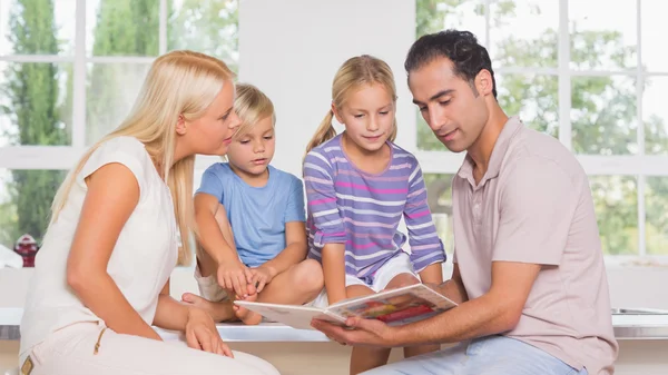 Calm family reading a story together