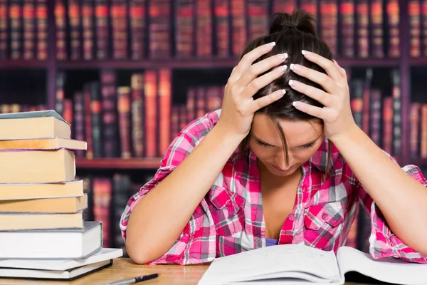 Stressed student in library