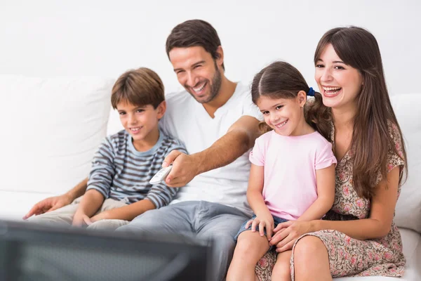 Happy family watching television