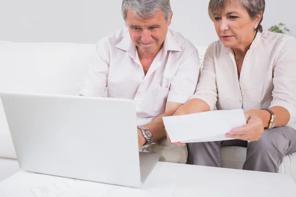 Old couple not understanding the accounts and using laptop