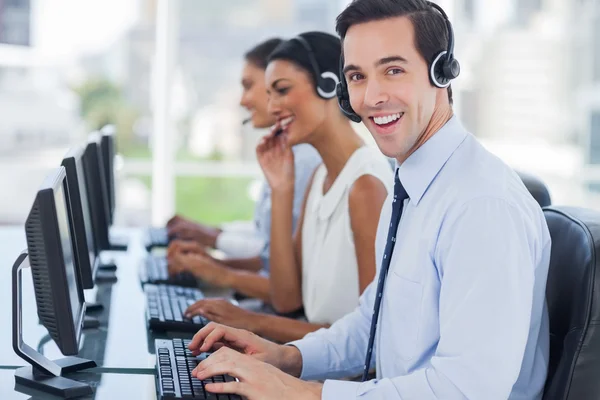Joyful agent working in a call centre