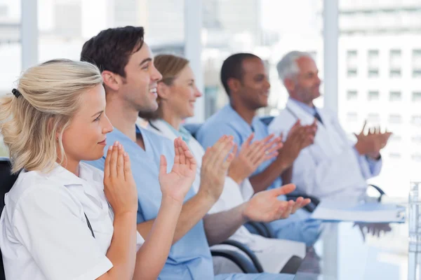 Medical team clapping hands