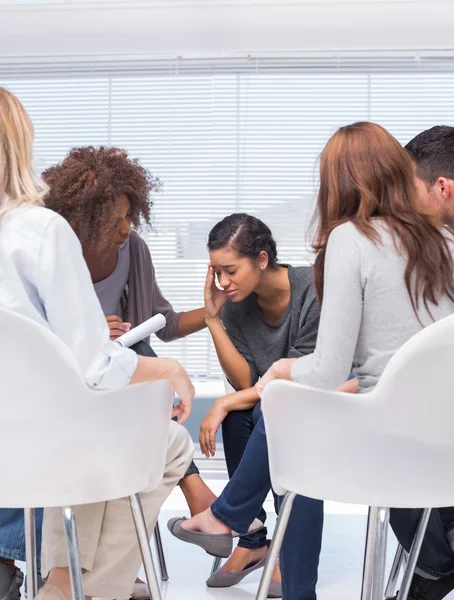 Therapist encouraging a patient