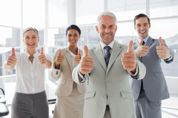 Business giving thumbs up