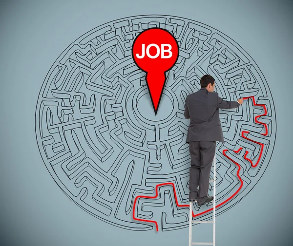 Businessman trying to find a job in a maze