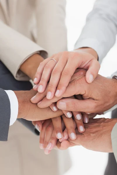 Business teams hands together