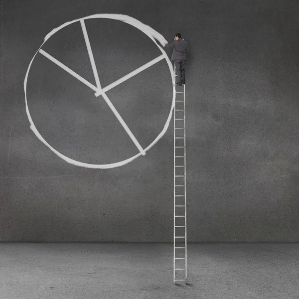 Businessman drawing a giant pie chart