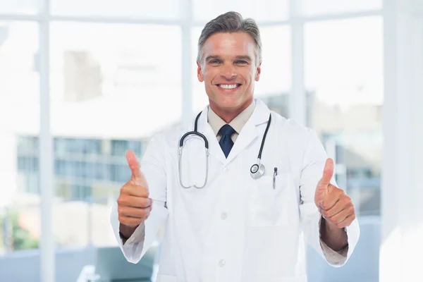 Experienced doctor posing thumbs up
