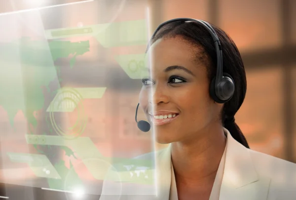 Pleased pretty businesswoman using futuristic interface hologram