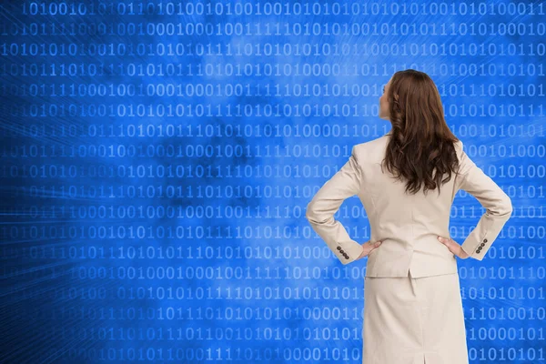 Composite image of businesswoman standing back to camera