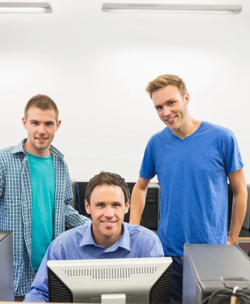 Teacher with students in the computer room