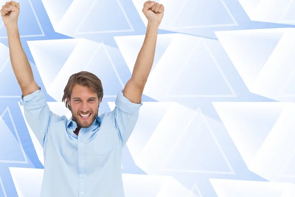 Man celebrating success with arms up