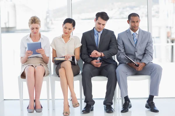 Business people waiting for job interview in office