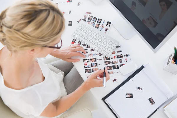 Female photo editor at work in the office